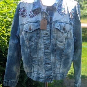 Woman Within Blue Denim Jacket with Skull Embroidery
